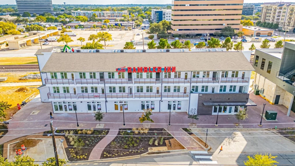 Boutique hotel Arlington TX exterior with parking and urban views